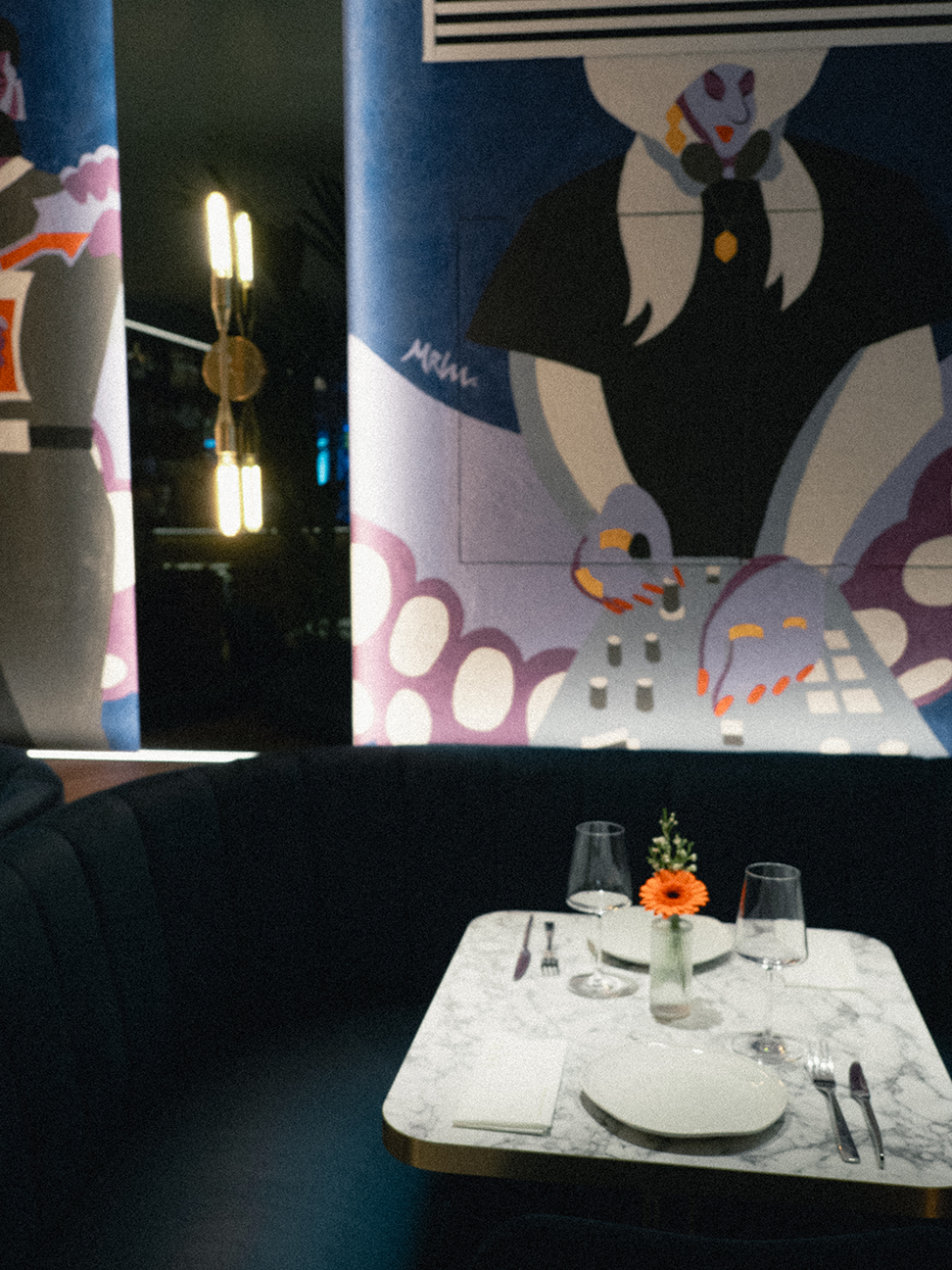 paintings inside of Skewd restaurant