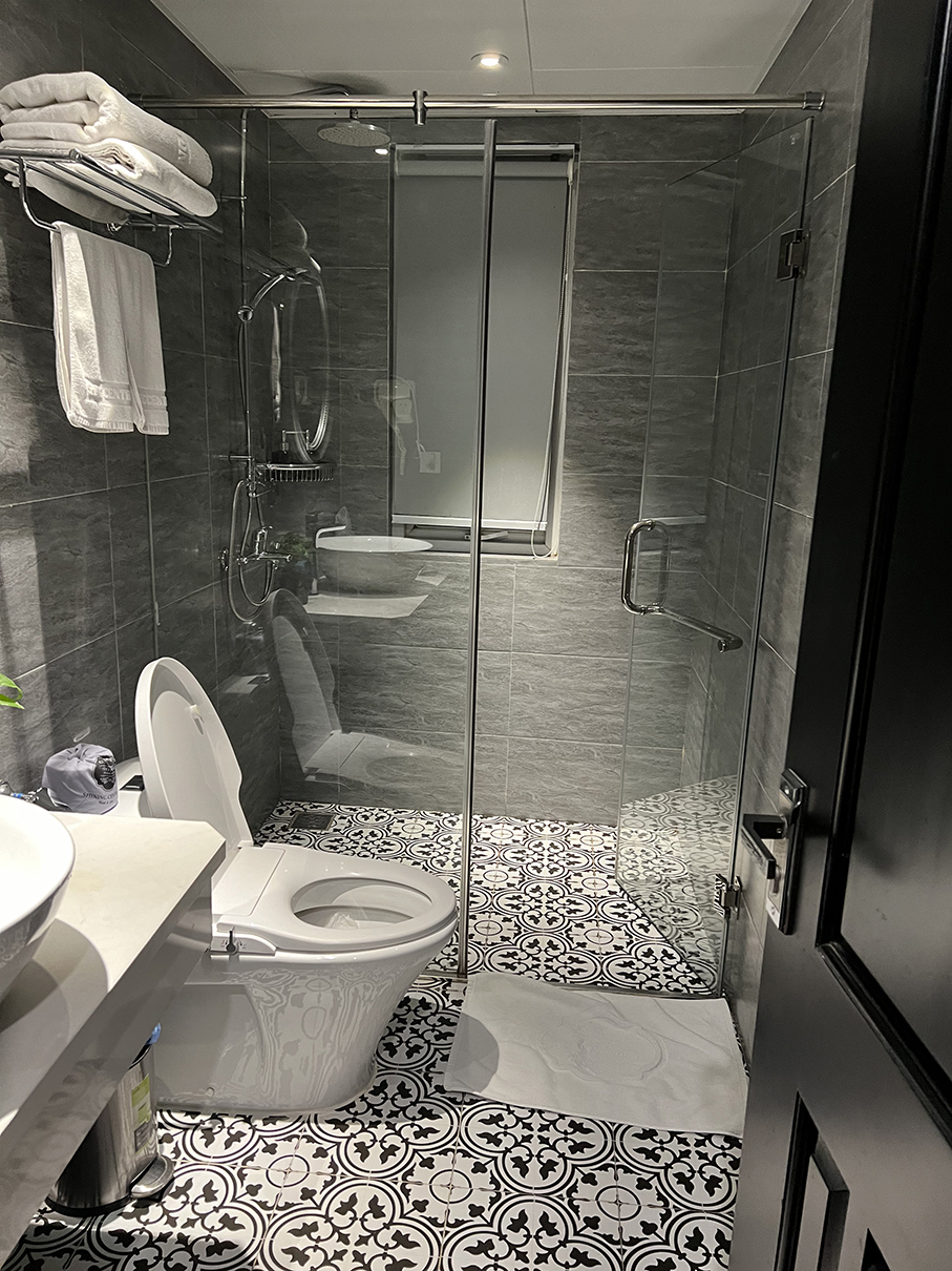 toilet and shower Shining Central Hotel